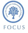 "F. O. C. U. S." (Focus On Children's Understanding In School) logo